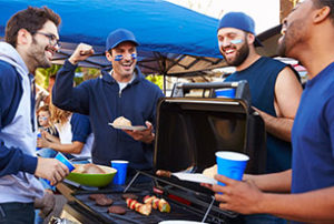 Image of football fans at a tailgate
