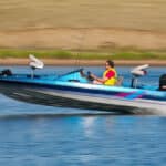 Image of someone driving a speedboat