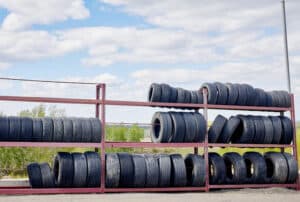 Image of used car tires on a rack